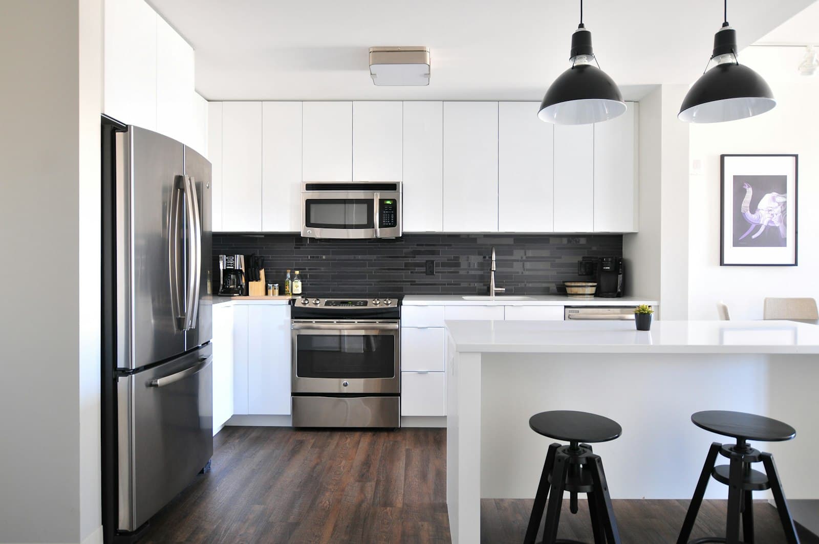 Contemporary kitchen with crisp painted walls and trim